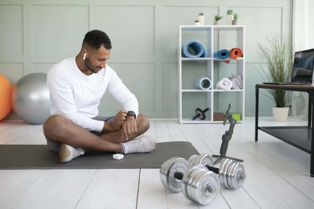 Cardiovascular exercise at home man sitting with weights