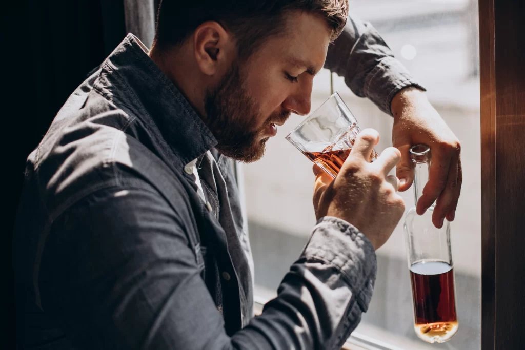 Testosterone killing foods man-drinker-depressed-with-bottle-whiskey